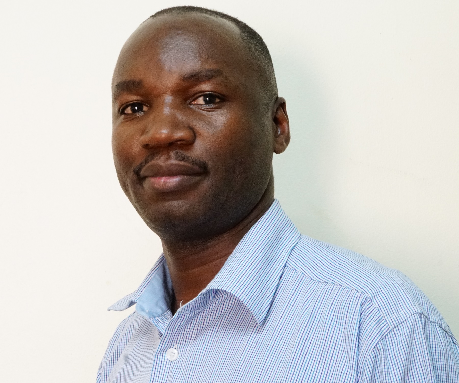 Dr. Simon Walusimbi